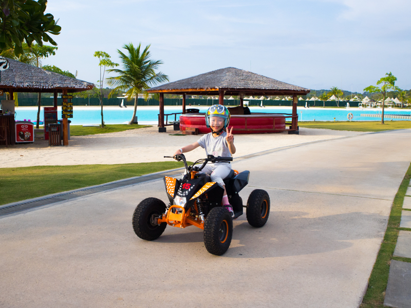 Kids adventure with Mini Electronic ATV around Crystal Lagoon